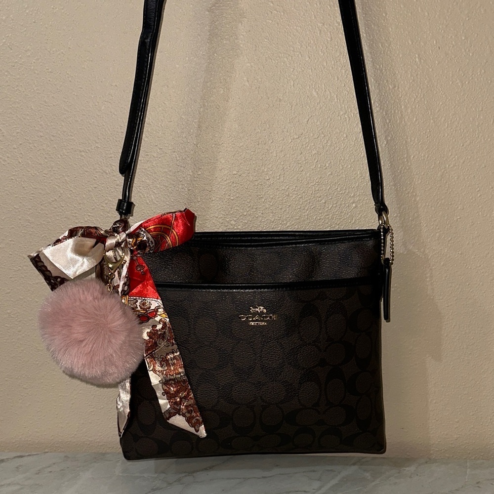 Coach Dark Brown/black Crossbody Bag with Gold Accents.